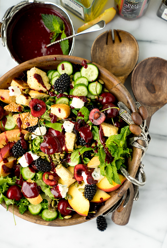 Stone Fruit and Berry Summer Salad with Balsamic Blackberry Vinaigrette. The salad you've been waiting for this summer! Peaches, nectarines, blackberries, cherries, herbs, roasted pepitas, toasty bread, cucumbers and gorgonzola. All drizzled with a generous serving of Balsamic Blackberry Vinaigrette dressing. | thesugarcoatedcottage.com