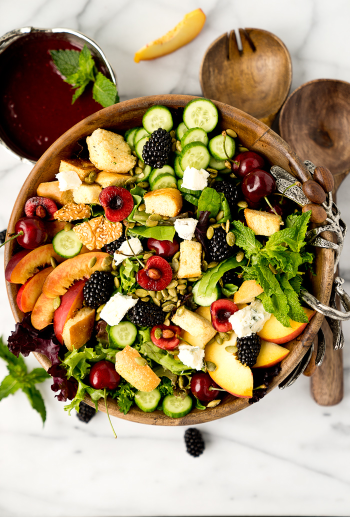 Stone Fruit and Berry Summer Salad with Balsamic Blackberry Vinaigrette. The salad you've been waiting for this summer! Peaches, nectarines, blackberries, cherries, herbs, roasted pepitas, toasty bread, cucumbers and gorgonzola. All drizzled with a generous serving of Balsamic Blackberry Vinaigrette dressing. | thesugarcoatedcottage.com