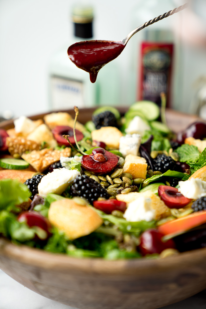 Stone Fruit and Berry Summer Salad with Balsamic Blackberry Vinaigrette. The salad you've been waiting for this summer! Peaches, nectarines, blackberries, cherries, herbs, roasted pepitas, toasty bread, cucumbers and gorgonzola. All drizzled with a generous serving of Balsamic Blackberry Vinaigrette dressing. | thesugarcoatedcottage.com