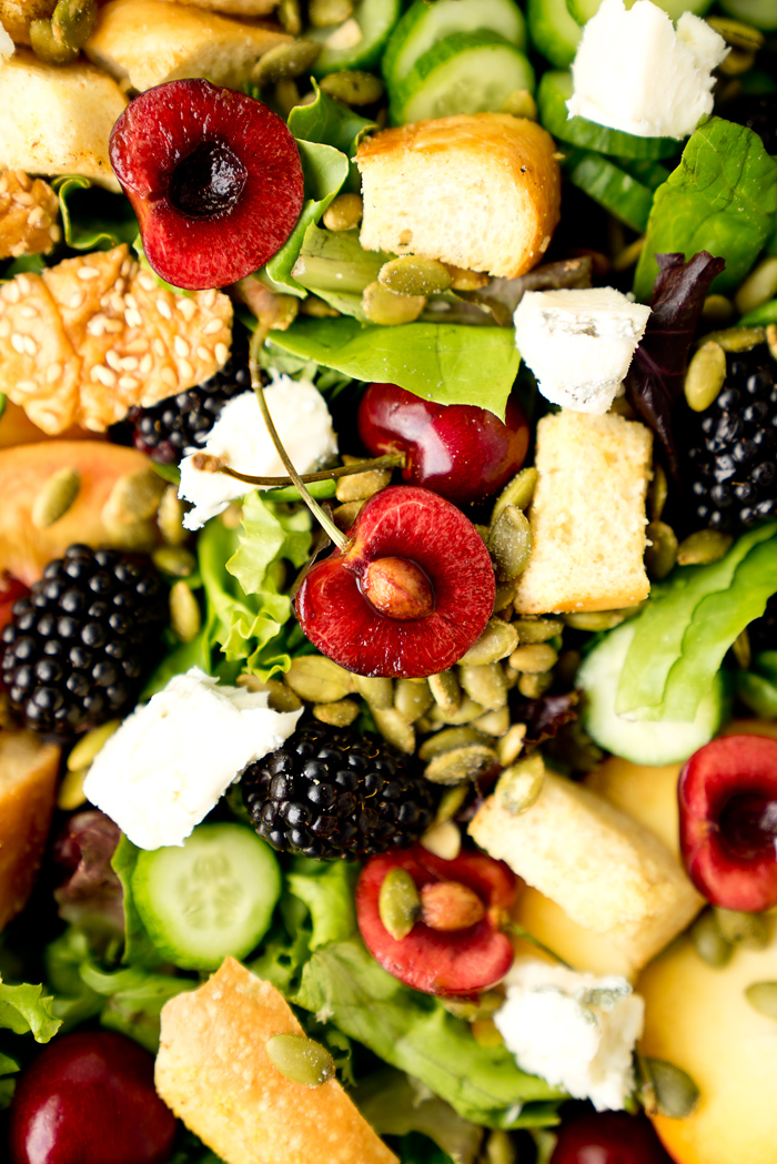 Stone Fruit and Berry Summer Salad with Balsamic Blackberry Vinaigrette. The salad you've been waiting for this summer! Peaches, nectarines, blackberries, cherries, herbs, roasted pepitas, toasty bread, cucumbers and gorgonzola. All drizzled with a generous serving of Balsamic Blackberry Vinaigrette dressing. | thesugarcoatedcottage.com