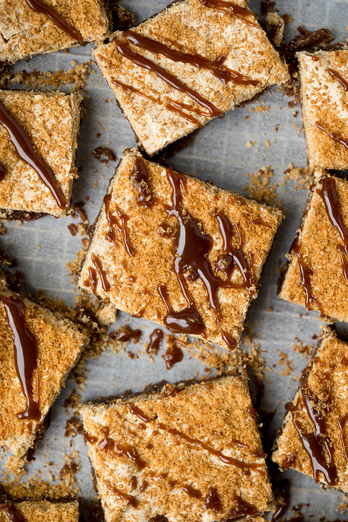 Dreamy Toasted Coconut Meringue Brownies! The only brownie recipe you need! Chocolatey, fudgey, chocolate chip studded brownie topped with a crisp, rich layer of brown sugar coconut meringue. 