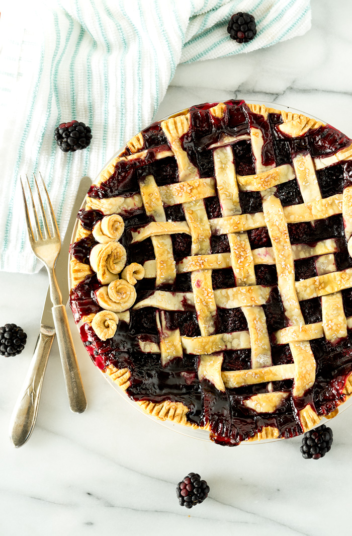 Scrumptious Black Berry Pie recipe! Plump, juicy, sweet, tart black berries gathered in a flaky, buttery, tender crust! | thesugarcoatedcottage.com