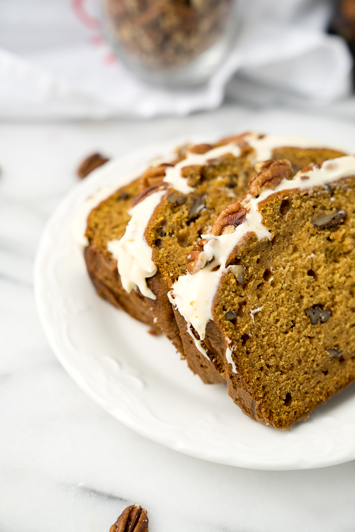 Pecan Pumpkin Bread with Pumpkin Spice Cream Cheese Glaze. The best pumpkin bread recipe and glaze you'll ever eat. | thesugarcoatedcottage.com