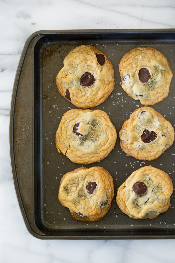 The Best Salted Chocolate Chip Cookie Recipe Ever. Crispy edges, chewy center, large baking chips and a sprinkling of sea salt make for one amazing cookie. | thesugarcoatedcottage.com