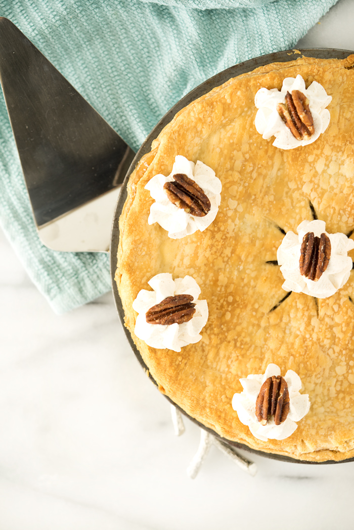 Simple Maple Pecan Pie with Cinnamon Whipped Cream. A traditional yet simple pie for any gathering. | thesugarcoatedcottage.com