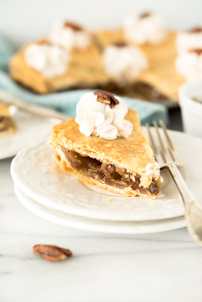 Simple Maple Pecan Pie with Cinnamon Whipped Cream. A traditional yet simple pie for any gathering. | thesugarcoatedcottage.com