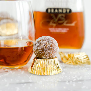 Brandy Pecan Ball Recipe. Need an awesome cookie to take to your next holiday gathering or maybe a cookie to snack on as the snow falls and you cuddle by the fireplace? Brandy Pecan Balls are the answer. | thesugarcoatedcottage.com