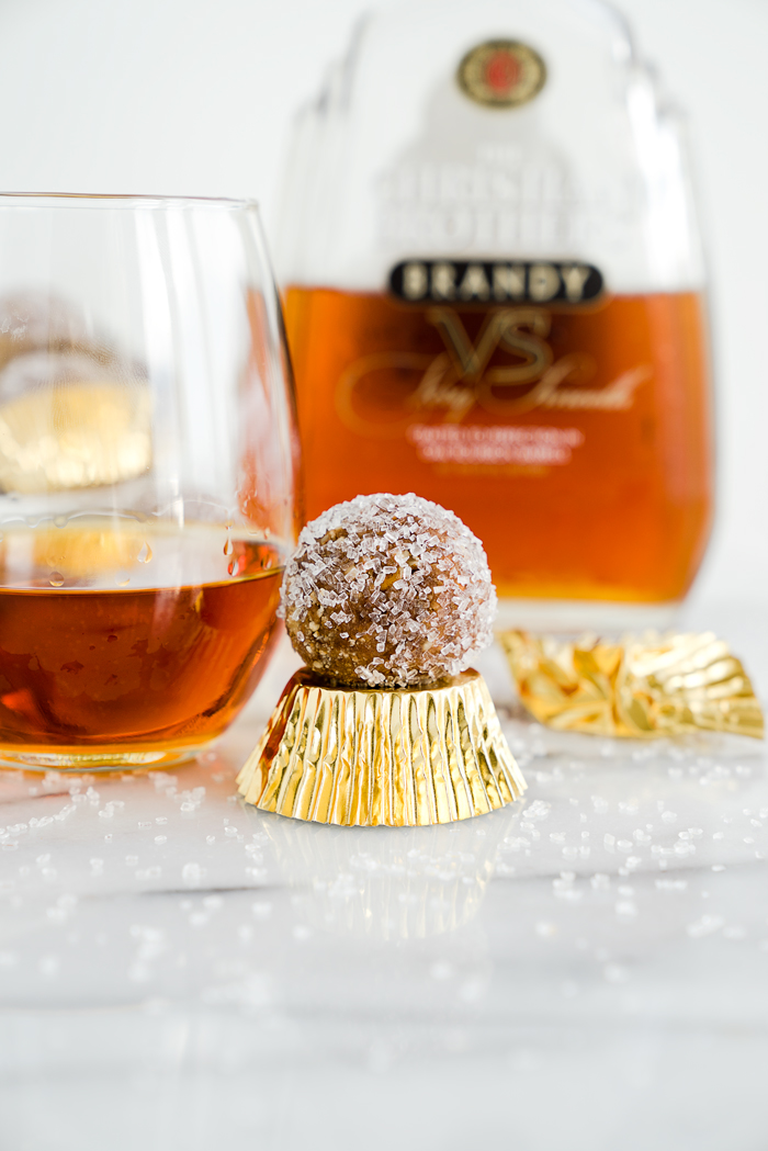 Brandy Pecan Ball Recipe. Need an awesome cookie to take to your next holiday gathering or maybe a cookie to snack on as the snow falls and you cuddle by the fireplace? Brandy Pecan Balls are the answer. | thesugarcoatedcottage.com