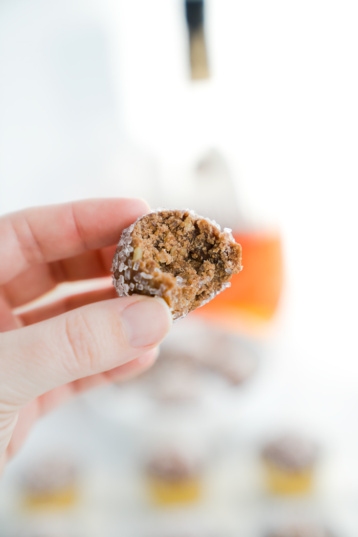 Brandy Pecan Ball Recipe. Need an awesome cookie to take to your next holiday gathering or maybe a cookie to snack on as the snow falls and you cuddle by the fireplace? Brandy Pecan Balls are the answer. | thesugarcoatedcottage.com