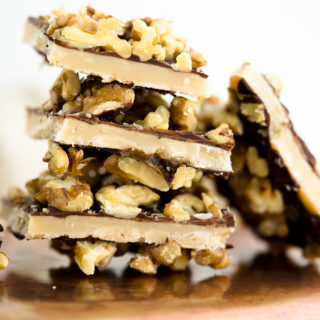 Chocolate Walnut Butter Crunch recipe!! Buttery, crunchy candy center coated in chocolate and sprinkled with roasted walnuts. | thesugarcoatedcottage.com