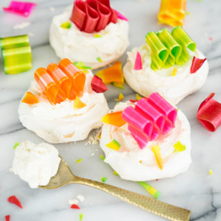 Orange Scented Mini Pavlovas recipe. Crispy, chewy meringues with a dollop of orange scented whipped cream! | thesugarcoatedcottage.com