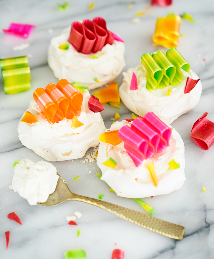 Orange Scented Mini Pavlovas recipe. Crispy, chewy meringues with a dollop of orange scented whipped cream! | thesugarcoatedcottage.com