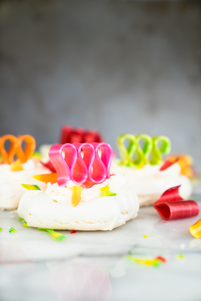 Orange Scented Mini Pavlovas recipe. Crispy, chewy meringues with a dollop of orange scented whipped cream! | thesugarcoatedcottage.com