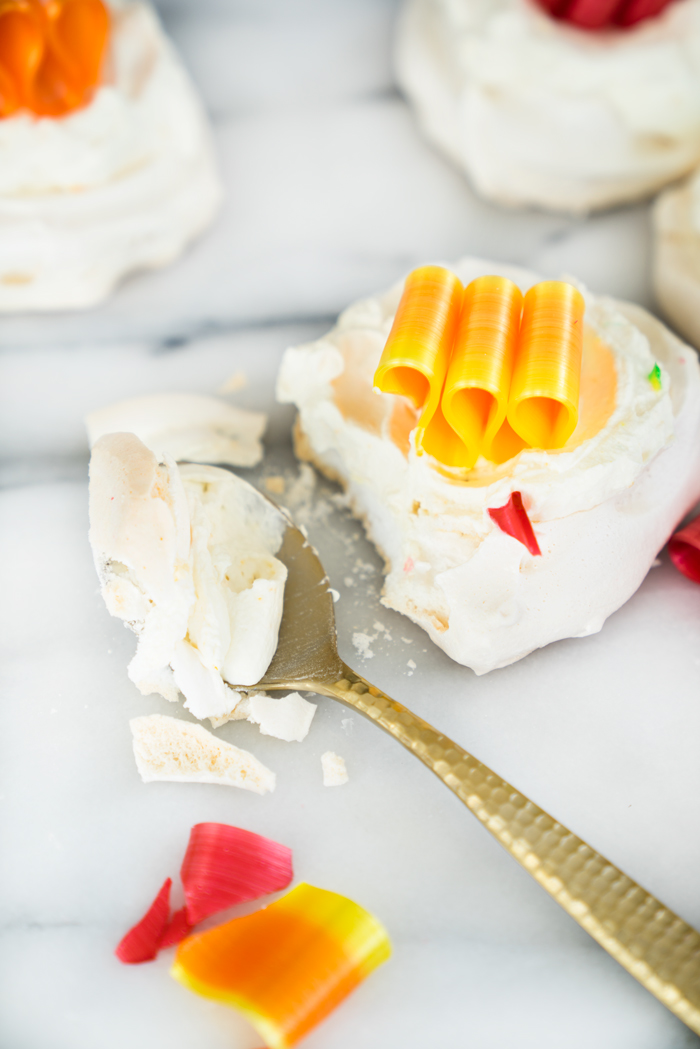 Orange Scented Mini Pavlovas recipe. Crispy, chewy meringues with a dollop of orange scented whipped cream! | thesugarcoatedcottage.com