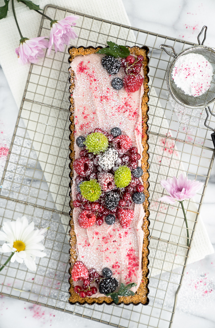 Raspberry Ganache Tart recipe. Smooth, rich and creamy raspberry ganache wrapped in a crunchy cookie crust. | thesugarcoatedcottage.com