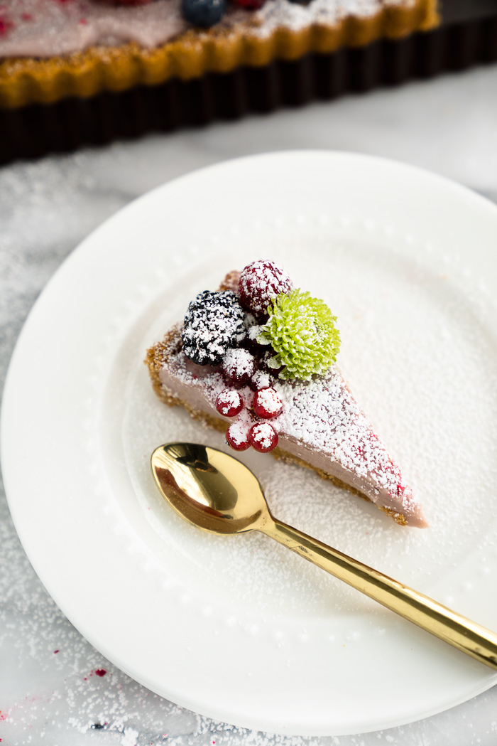 Raspberry Ganache Tart recipe. Smooth, rich and creamy raspberry ganache wrapped in a crunchy cookie crust. | thesugarcoatedcottage.com