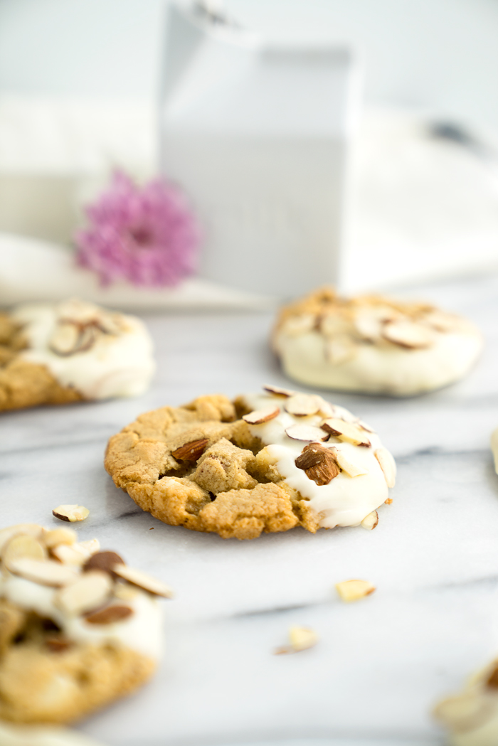 White Chocolate Roasted Almond Cookie Recipe. Crispy, crinkly, buttery cookies studded with crunchy roasted almonds and creamy white chocolate chips. | thesugarcoatedcottage.com