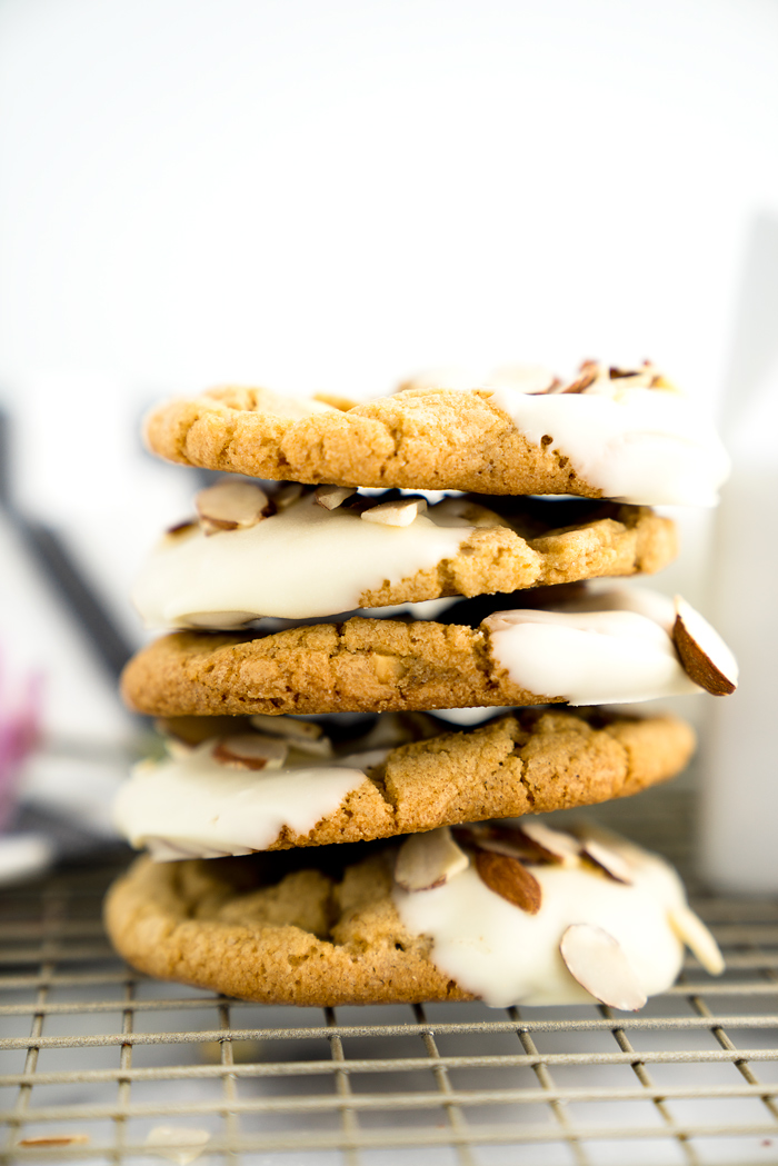 White Chocolate Roasted Almond Cookie Recipe. Crispy, crinkly, buttery cookies studded with crunchy roasted almonds and creamy white chocolate chips. | thesugarcoatedcottage.com