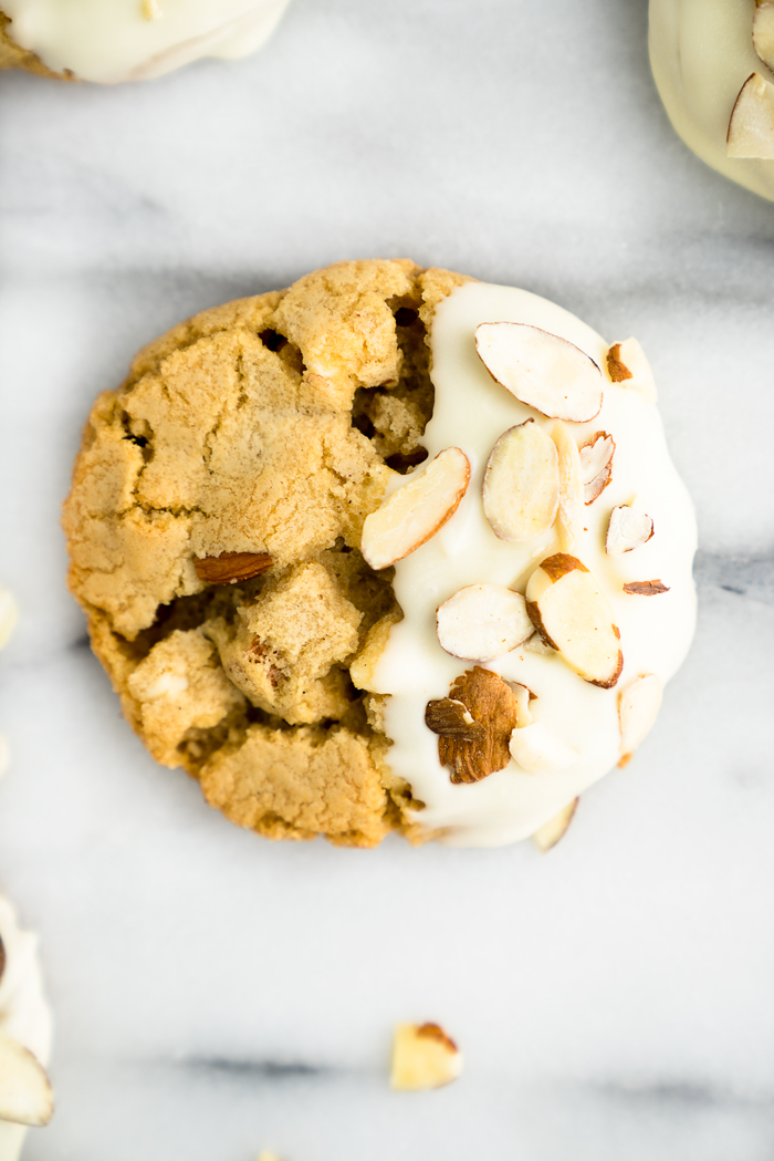 White Chocolate Roasted Almond Cookie Recipe. Crispy, crinkly, buttery cookies studded with crunchy roasted almonds and creamy white chocolate chips. | thesugarcoatedcottage.com