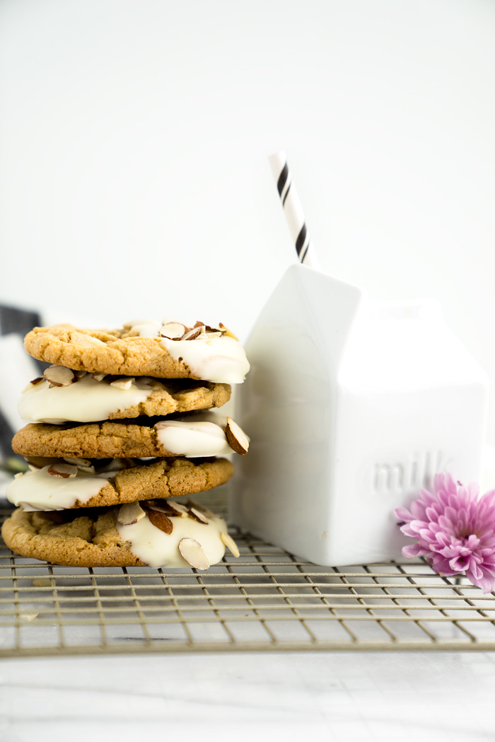 White Chocolate Roasted Almond Cookie Recipe. Crispy, crinkly, buttery cookies studded with crunchy roasted almonds and creamy white chocolate chips. | thesugarcoatedcottage.com