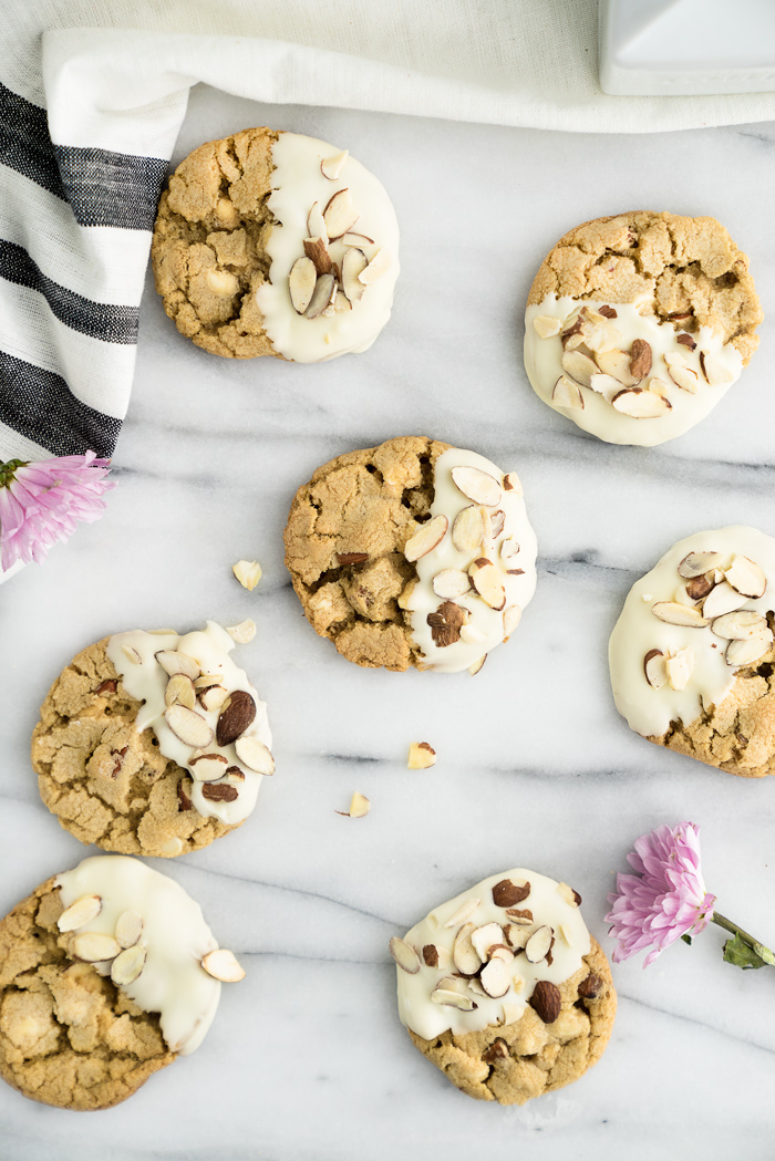 White Chocolate Roasted Almond Cookie Recipe. Crispy, crinkly, buttery cookies studded with crunchy roasted almonds and creamy white chocolate chips. | thesugarcoatedcottage.com