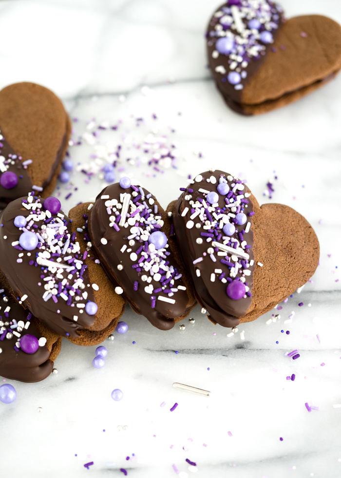 Double Chocolate Ganache Sandwich Cookie Recipe. Creamy chocolate ganache truffle filling sandwiched between two crispy chocolate cookies. Perfect for valentines day or any special occasion. | thesugarcoatedcottage.com