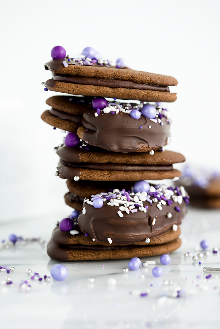 Double Chocolate Ganache Sandwich Cookie Recipe. Creamy chocolate ganache truffle filling sandwiched between two crispy chocolate cookies. Perfect for valentines day or any special occasion. | thesugarcoatedcottage.com