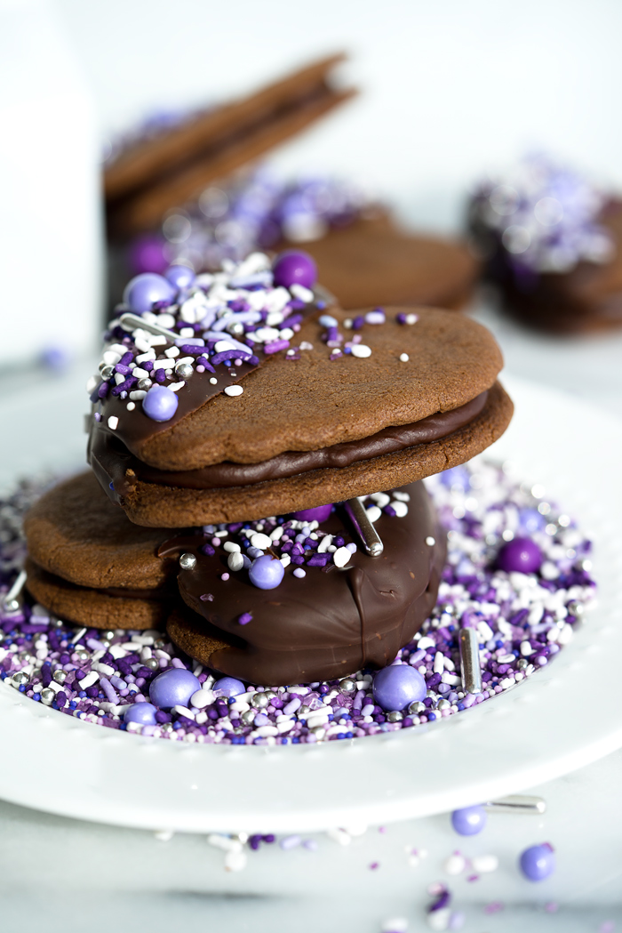 Double Chocolate Ganache Sandwich Cookie Recipe. Creamy chocolate ganache truffle filling sandwiched between two crispy chocolate cookies. Perfect for valentines day or any special occasion. | thesugarcoatedcottage.com