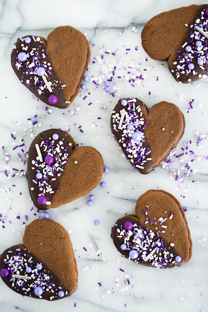 Double Chocolate Ganache Sandwich Cookie Recipe. Creamy chocolate ganache truffle filling sandwiched between two crispy chocolate cookies. Perfect for valentines day or any special occasion. | thesugarcoatedcottage.com