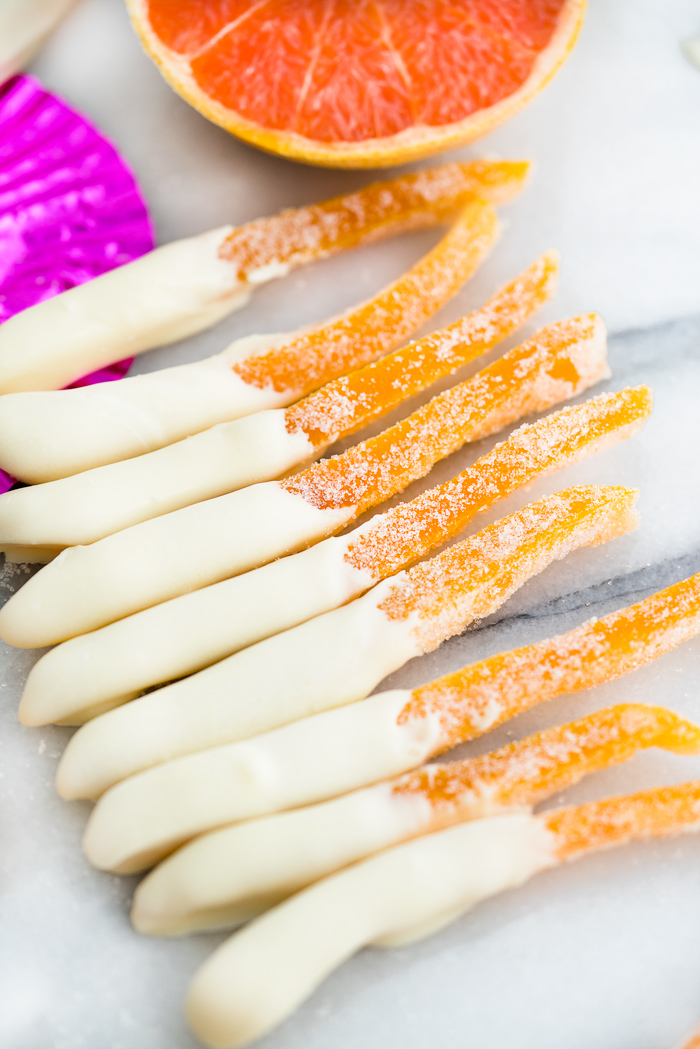 White Chocolate Covered Candied Grapefruit Peel Recipe. Bitter sweet grapefruit peel candied to perfection and dipped in sweet, creamy white chocolate. 3 ingredient, no bake, candy. | thesugarcoatedcottage.com