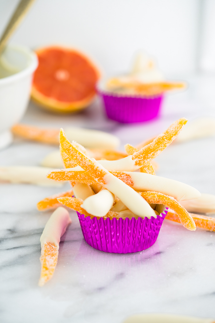 White Chocolate Covered Candied Grapefruit Peel Recipe. Bitter sweet grapefruit peel candied to perfection and dipped in sweet, creamy white chocolate. 3 ingredient, no bake, candy. | thesugarcoatedcottage.com
