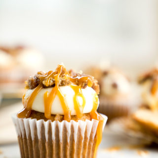 Candied Pecan Banana Cupcake Recipe. Easy stove top candied pecans crumbled on top of cream cheese frosting, drizzled with butterscotch on top of a sweet banana cupcake! | thesugarcoatedcottage.com, candied pecans, cream cheese frosting, butterscotch, banana, recipe, cupcake. #cupcake #recipe