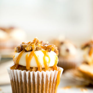 Candied Pecan Banana Cupcake Recipe. Easy stove top candied pecans crumbled on top of cream cheese frosting, drizzled with butterscotch on top of a sweet banana cupcake! | thesugarcoatedcottage.com, candied pecans, cream cheese frosting, butterscotch, banana, recipe, cupcake. #cupcake #recipe
