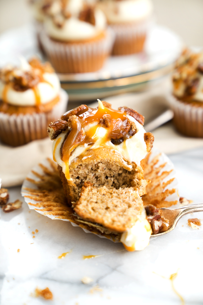 Candied Pecan Banana Cupcake Recipe. Easy stove top candied pecans crumbled on top of cream cheese frosting, drizzled with butterscotch on top of a sweet banana cupcake! | thesugarcoatedcottage.com, candied pecans, cream cheese frosting, butterscotch, banana, recipe, cupcake. #cupcake #recipe