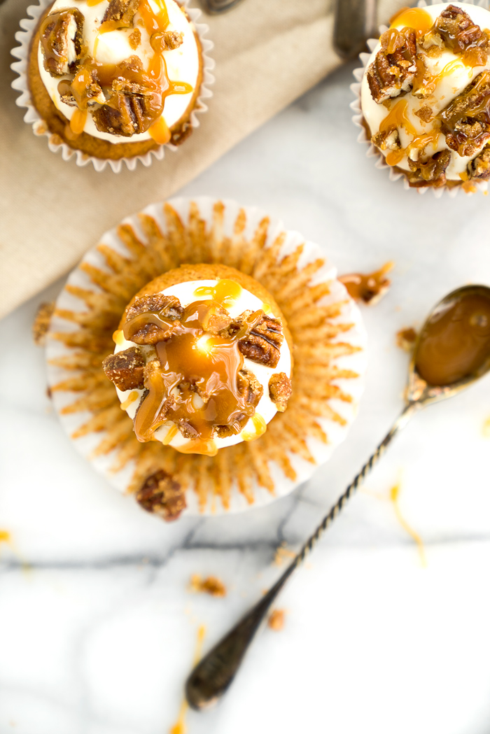 Candied Pecan Banana Cupcake Recipe. Easy stove top candied pecans crumbled on top of cream cheese frosting, drizzled with butterscotch on top of a sweet banana cupcake! | thesugarcoatedcottage.com, candied pecans, cream cheese frosting, butterscotch, banana, recipe, cupcake. #cupcake #recipe