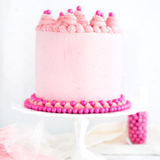Its a Girl Baby Shower Cake Recipe! White Chocolate Cake coated in a delicate pink white chocolate swiss meringue buttercream. Pink cake, frosting, buttercream, baby shower, cake. | thesugarcoatedcottage.com