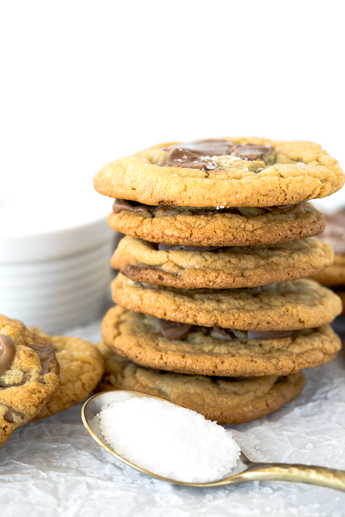 Valrhona Hazelnut Milk Chocolate Chip Cookie Recipe. This fabulous cookie is studded with Valrhona Hazelnut Milk Chocolate Feves (chips) and sprinkled with sea salt. Luxurious, smooth and creamy sums up this cookie! | thesugarcoatedcottage.com #valrhona #chocolatechipcookie #milk chocolate