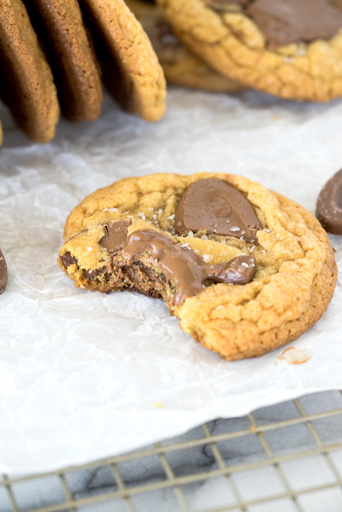 Valrhona Hazelnut Milk Chocolate Chip Cookie Recipe. This fabulous cookie is studded with Valrhona Hazelnut Milk Chocolate Feves (chips) and sprinkled with sea salt. Luxurious, smooth and creamy sums up this cookie! | thesugarcoatedcottage.com #valrhona #chocolatechipcookie #milk chocolate