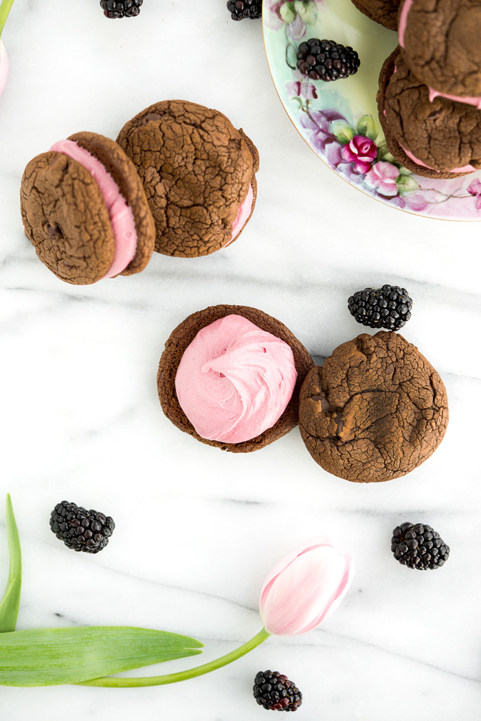 Blackberry Buttercream Double Chocolate Sandwich Cookie Recipe. Sweet blackberry buttercream sandwiched between two double chocolate cookies. #cookies #buttercream #recipe #blackberry | thesugarcoatedcottage.com