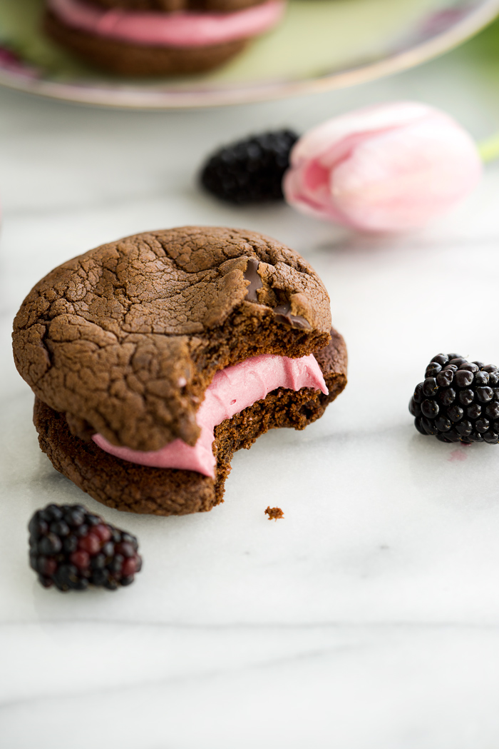 Blackberry Buttercream Double Chocolate Sandwich Cookie Recipe. Sweet blackberry buttercream sandwiched between two double chocolate cookies. #cookies #buttercream #recipe #blackberry | thesugarcoatedcottage.com