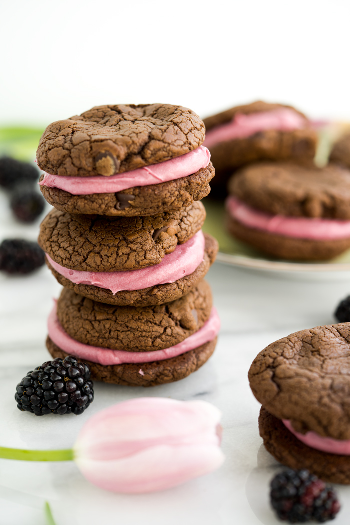 Blackberry Buttercream Double Chocolate Sandwich Cookie Recipe. Sweet blackberry buttercream sandwiched between two double chocolate cookies. #cookies #buttercream #recipe #blackberry | thesugarcoatedcottage.com