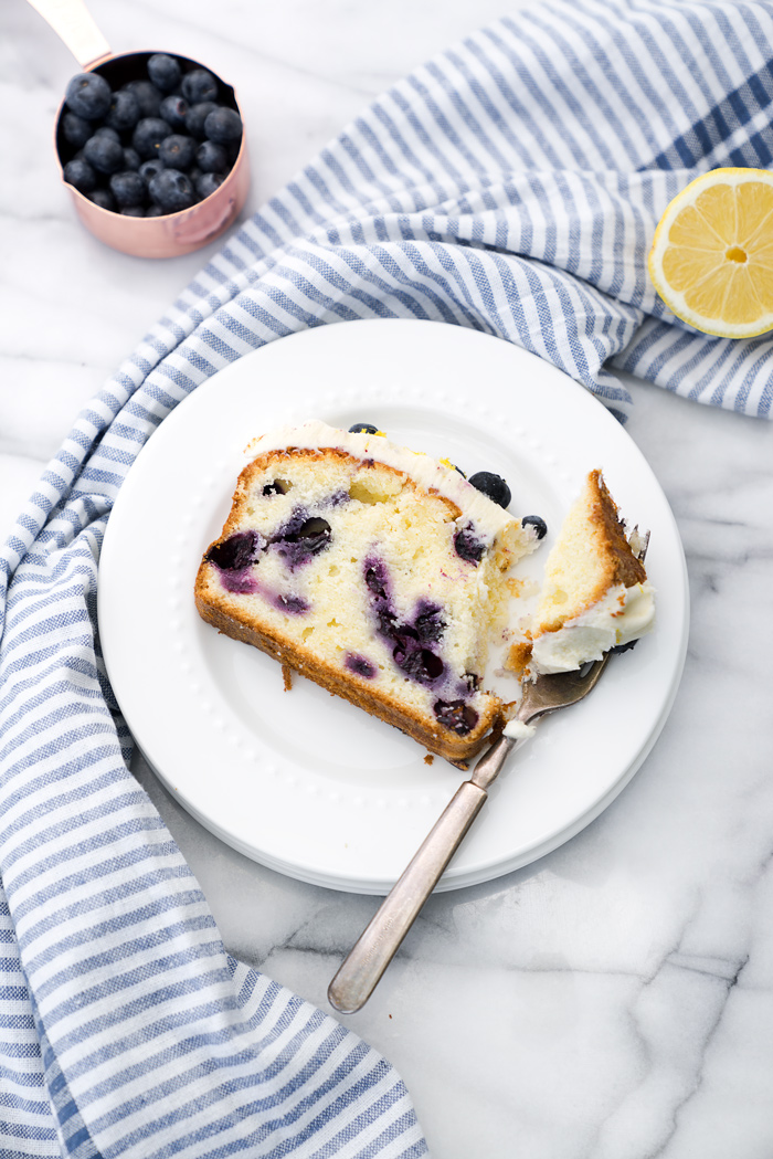 Cream Cheese Lemon Blueberry Pound Cake Recipe. Moist and creamy lemony pound cake studded with sweet plump blueberries. There is nothing like a great pound cake! | thesugarcoatedcottage.com #lemon #recipe #blueberry #cake #poundcake