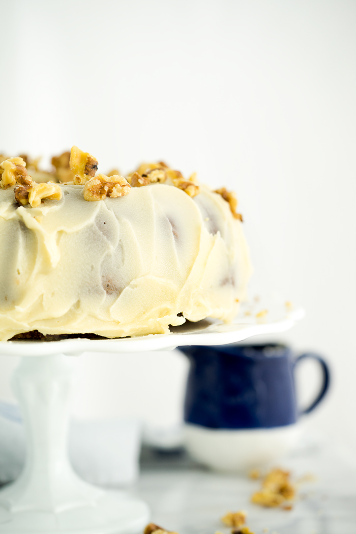 Rum Raisin Carrot Bundt Cake Recipe. Moist, dense, spiced carrot cake with spiced rum soaked raisins and buttery rum icing. The best carrot cake! | thesugarcoatedcottage.com #cake #carrotcake #bundtcake