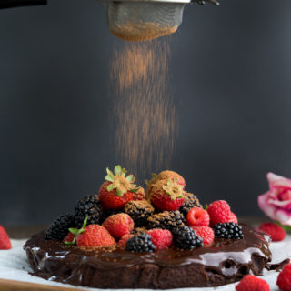 Fudgy Ganache Brownie Cake. Rich fudgy brownie slathered in creamy ganache and topped with fresh berries. | thesugarcoatedcottage.com #brownies #cake