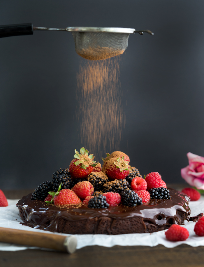 Fudgy Ganache Brownie Cake. Rich fudgy brownie slathered in creamy ganache and topped with fresh berries. | thesugarcoatedcottage.com #brownies #cake