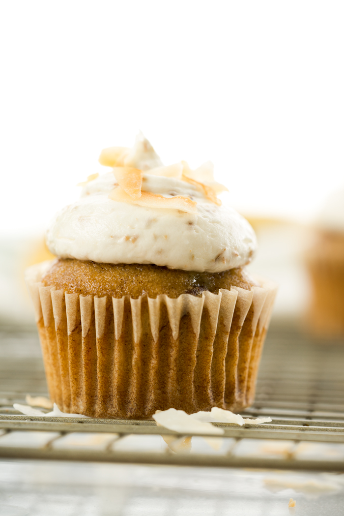 Hummingbird Cupcakes & Toasted Coconut Buttercream. A southern classic topped with a swirl of smooth and creamy toasted coconut buttercream. | thesugarcoatedcottage.com #banana #cupcake #hummingbird