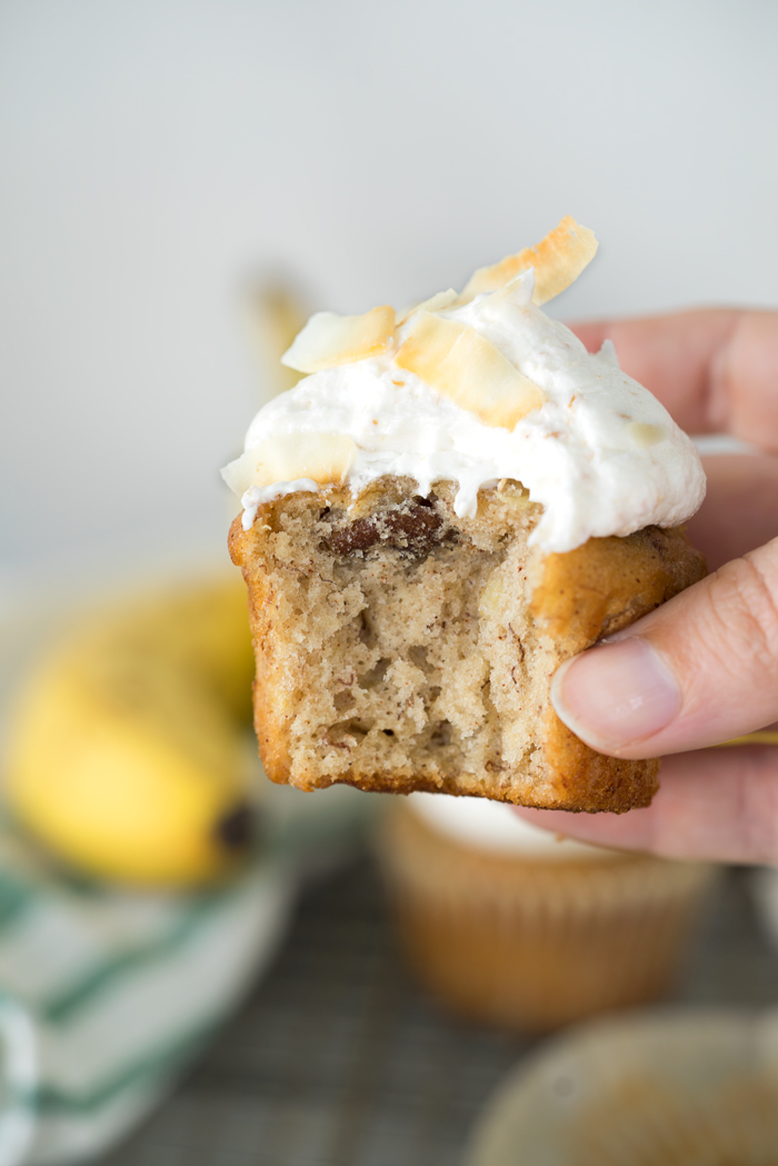 Hummingbird Cupcakes & Toasted Coconut Buttercream. A southern classic topped with a swirl of smooth and creamy toasted coconut buttercream. | thesugarcoatedcottage.com #banana #cupcake #hummingbird