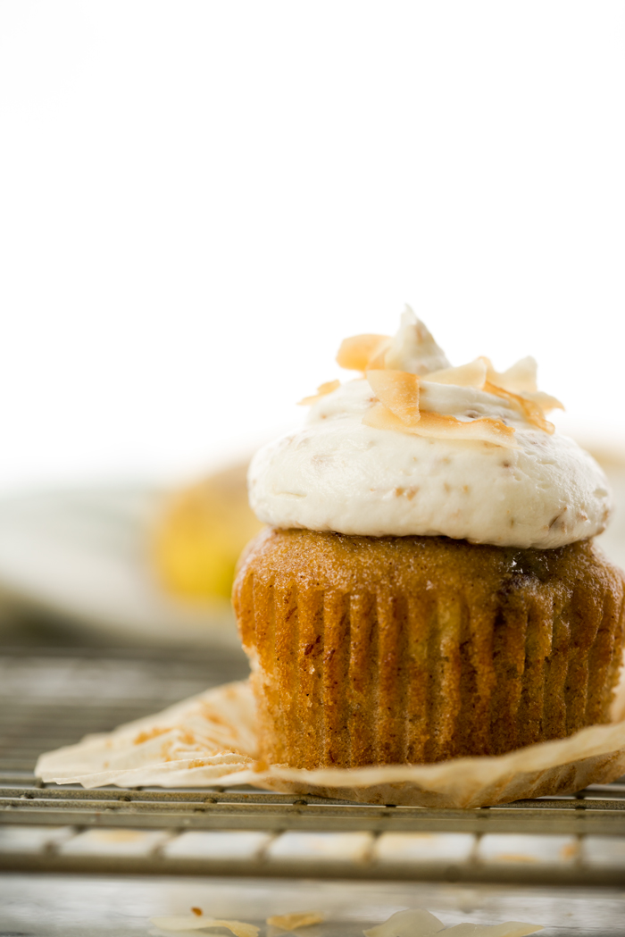 Hummingbird Cupcakes & Toasted Coconut Buttercream. A southern classic topped with a swirl of smooth and creamy toasted coconut buttercream. | thesugarcoatedcottage.com #banana #cupcake #hummingbird