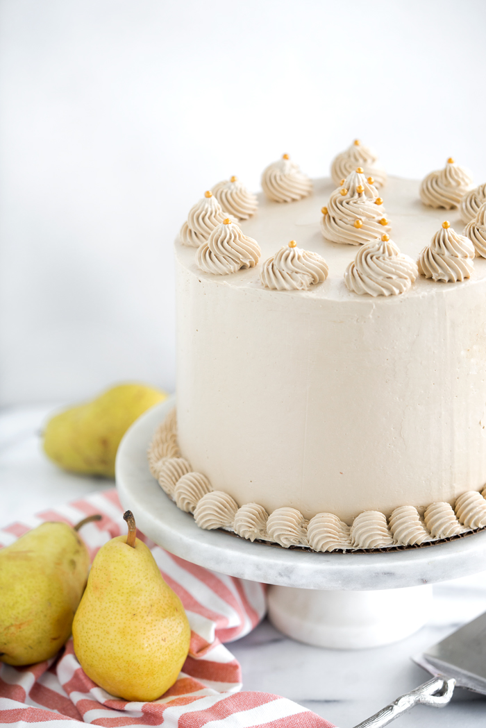 Pear Spice Cake with Dark Brown Sugar Buttercream. Layers of spice cake, caramelized pears and dark brown sugar buttercream. | thesugarcoatedcottage.com