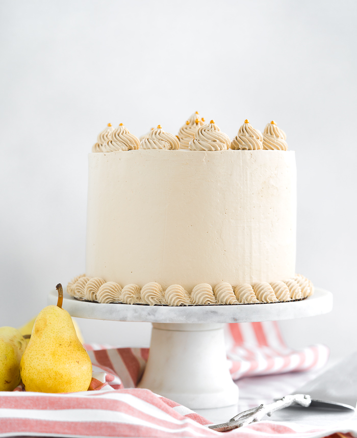 Pear Spice Cake with Dark Brown Sugar Buttercream. Layers of spice cake, caramelized pears and dark brown sugar buttercream. | thesugarcoatedcottage.com